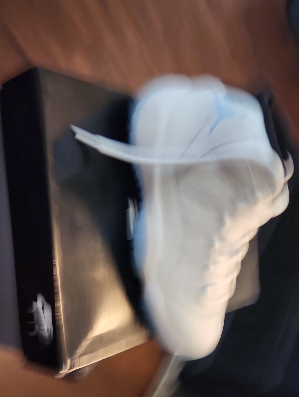 Jordan White High-Top Sneakers with Light Blue Accent